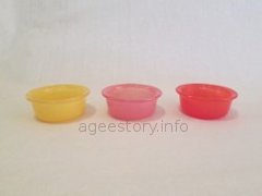 three coloured pyrex dishes